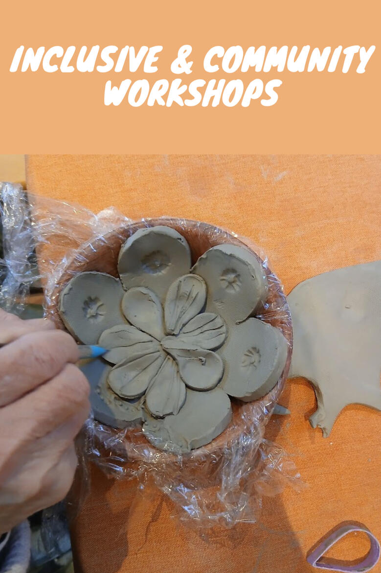 Close up of elderly person's hands making a clay bowl in the shape of a flower