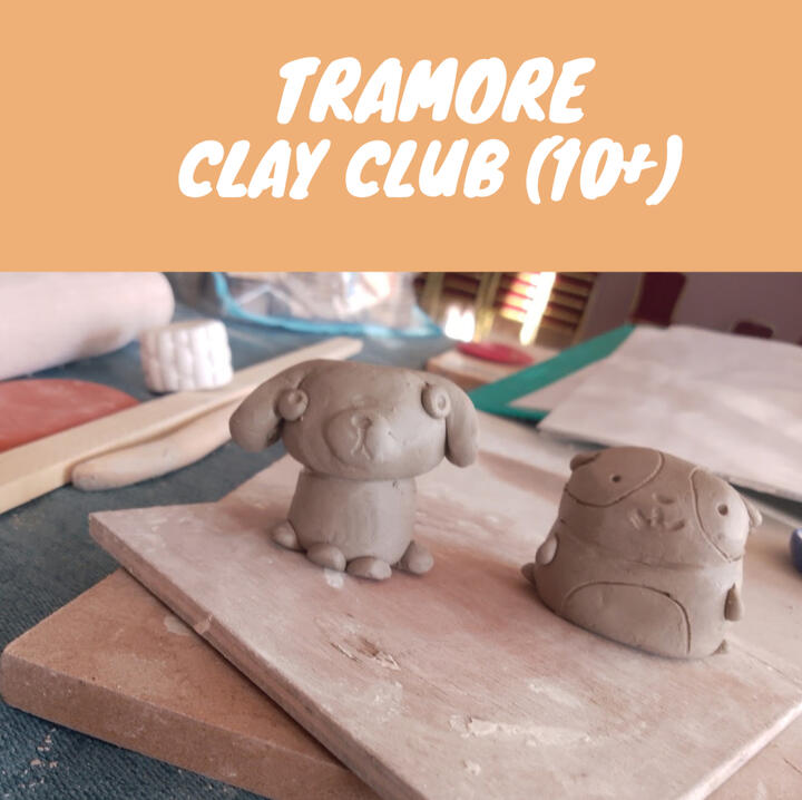 Children blowing glaze onto bisque ceramics